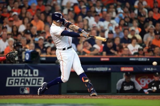 Carlos Correa of the Houston Astros singles during the 2nd inning of Game 1 of the American League Division Series against the Chicago White Sox at...