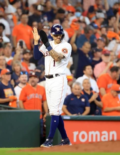 Carlos Correa of the Houston Astros reacts after reaching third base on an RBI single by Jake Meyers during the 2nd inning of Game 1 of the American...