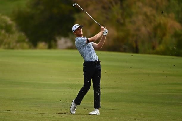 Will Zalatoris hits his second shot on the 18th hole during round one of the Shriners Children's Open at TPC Summerlin on October 07, 2021 in Las...