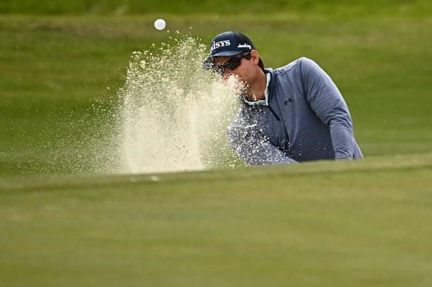 Adam Schenk hits from the bunker on the ninth hole during round one of the Shriners Children's Open at TPC Summerlin on October 07, 2021 in Las...