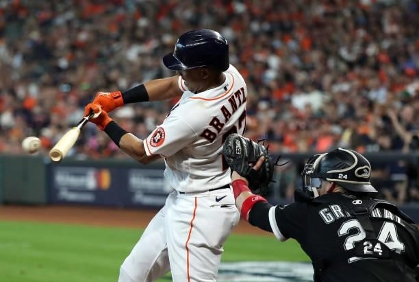 Michael Brantley of the Houston Astros connects for a single during the 6th inning of Game 1 of the American League Division Series against the...