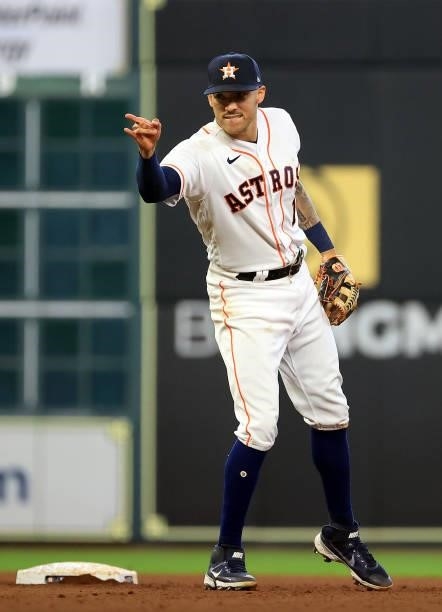 Carlos Correa of the Houston Astros reacts after turning a double play during the 7th inning of Game 1 of the American League Division Series against...