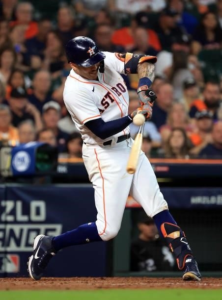 Carlos Correa of the Houston Astros singles during the 7th inning of Game 1 of the American League Division Series against the Chicago White Sox at...