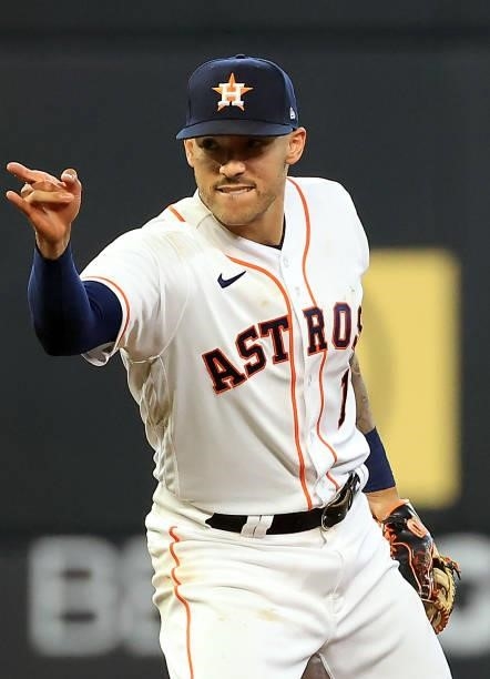 Carlos Correa of the Houston Astros reacts after turning a double play during the 7th inning of Game 1 of the American League Division Series against...