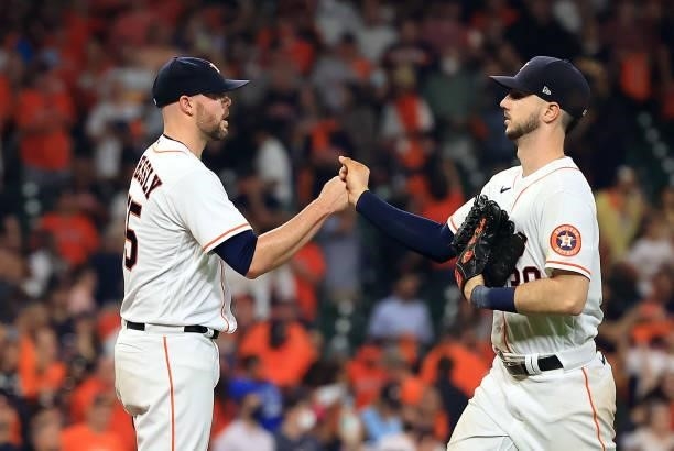 Kyle Tucker of the Houston Astros congratulates pitcher Ryan Pressly after the Astros defeated the Chicago White Sox 6-1 to win game 1 of the...