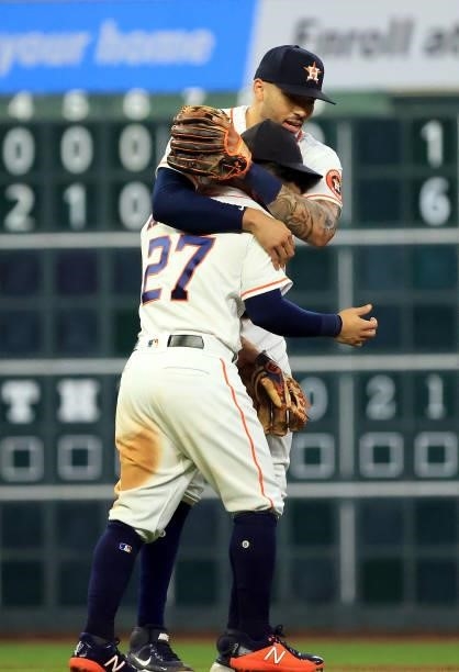 Carlos Correa and Jose Altuve of the Houston Astros congratulate each other after the Astros defeated the Chicago White Sox 6-1 to win game 1 of the...