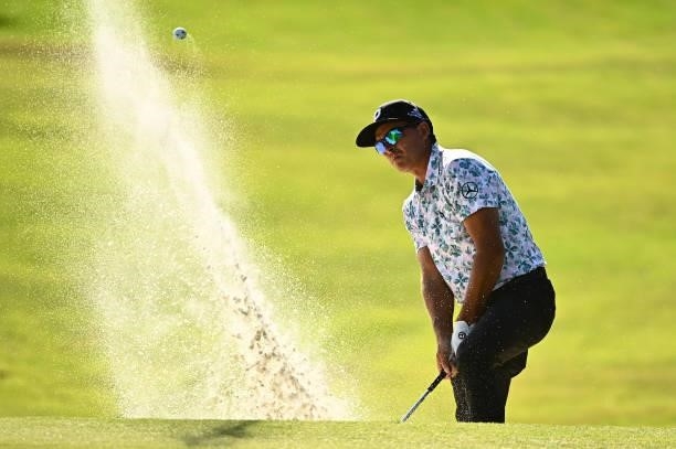 Rickie Fowler hits from the bunker on the 11th hole during round one of the Shriners Children's Open at TPC Summerlin on October 07, 2021 in Las...