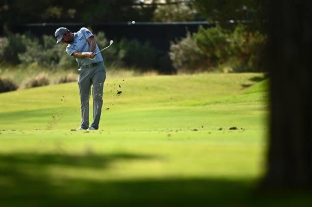 Webb Simpson hits an approach shot on the 11th hole during round one of the Shriners Children's Open at TPC Summerlin on October 07, 2021 in Las...