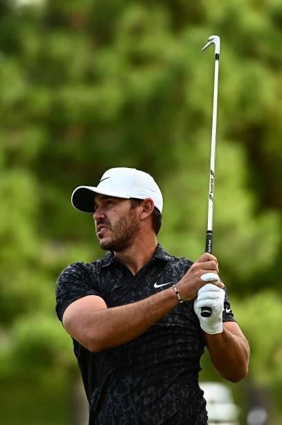 Brooks Koepka hits an approach shot on the ninth hole during round one of the Shriners Children's Open at TPC Summerlin on October 07, 2021 in Las...