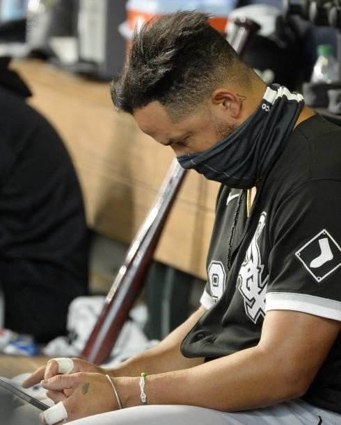Jose Abreu of the Chicago White Sox looks at a computer tablet during the game against the Houston Astros during Game One of the American League...