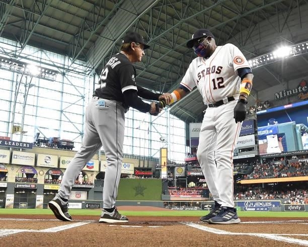 Manager Tony La Russa of the Chicago White Sox greets Manger Dusty Baker Jr. #12 of the Houston Astros during introductions prior to Game One of the...