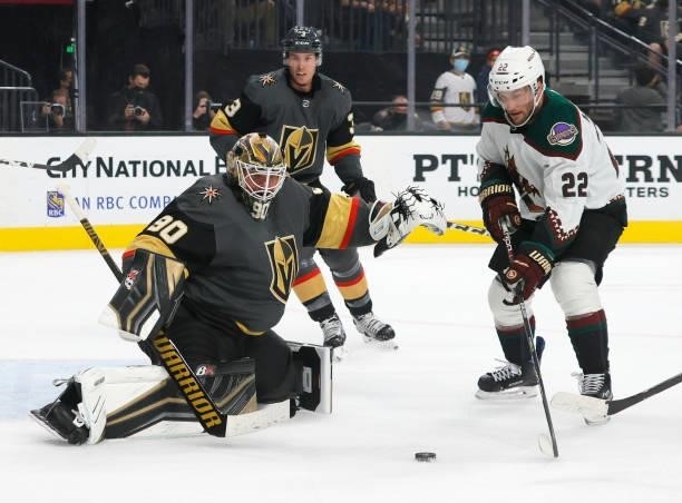 Johan Larsson of the Arizona Coyotes looks for a rebound as Robin Lehner of the Vegas Golden Knights defends the net in the first period of their...