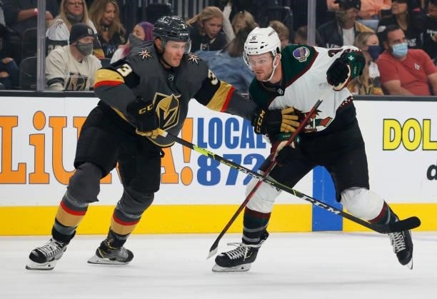 Brayden McNabb of the Vegas Golden Knights defends against Christian Fischer of the Arizona Coyotes in the first period of their preseason game at...