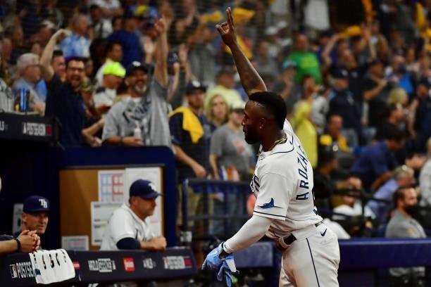 Randy Arozarena of the Tampa Bay Rays celebrates after stealing home in the seventh inning against the Boston Red Sox during Game 1 of the American...