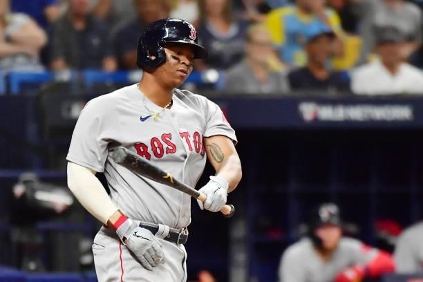 Rafael Devers of the Boston Red Sox reacts after striking out in the eighth inning against the Tampa Bay Rays during Game 1 of the American League...