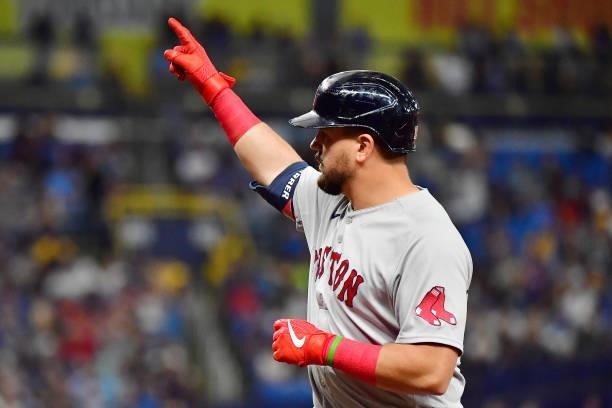 Kyle Schwarber of the Boston Red Sox celebrates his single in the eighth inning against the Tampa Bay Rays during Game 1 of the American League...