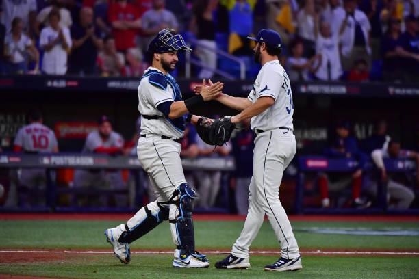 Feyereisen and Mike Zunino of the Tampa Bay Rays celebrate their 5-0 win over the Boston Red Sox during Game 1 of the American League Division Series...