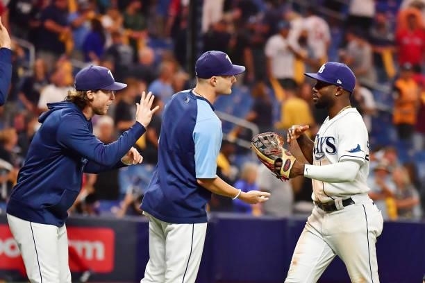 Randy Arozarena and Shane McClanahan of the Tampa Bay Rays celebrate their 5-0 win over the Boston Red Sox during Game 1 of the American League...