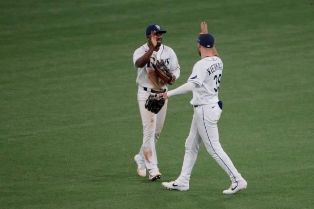 Randy Arozarena and Kevin Kiermaier of the Tampa Bay Rays celebrate their 5-0 win over the Boston Red Sox during Game 1 of the American League...