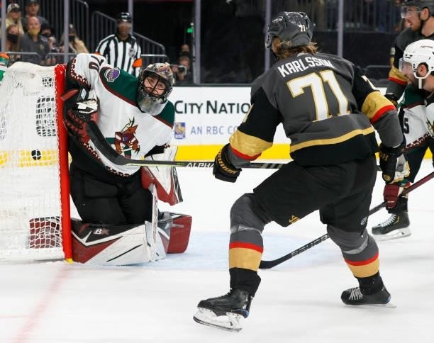 William Karlsson of the Vegas Golden Knights scores a second-period power-play goal against Karel Vejmelka of the Arizona Coyotes during their...
