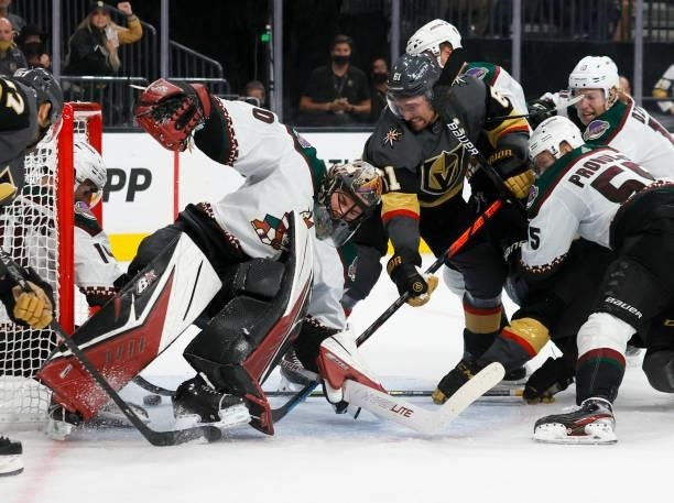 Karel Vejmelka of the Arizona Coyotes defends the net against Mark Stone of the Vegas Golden Knights in the second period of their preseason game at...