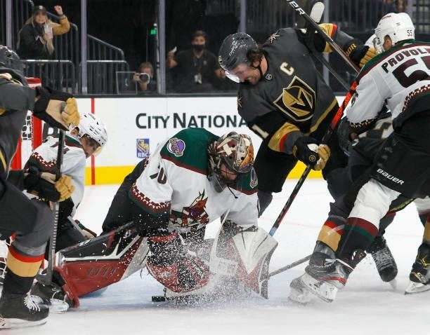 Karel Vejmelka of the Arizona Coyotes defends the net against Mark Stone of the Vegas Golden Knights in the second period of their preseason game at...