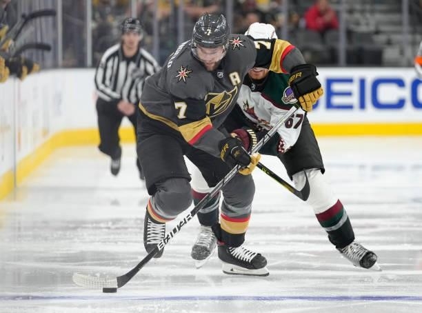 Lawson Crouse of the Arizona Coyotes battles Alex Pietrangelo of the Vegas Golden Knights during the third period of a game at T-Mobile Arena on...