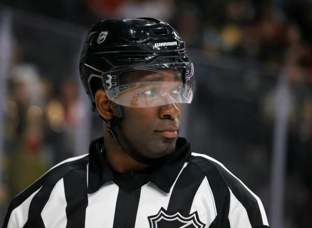 Referee Jordan Samuels-Thomas officiates a preseason game between the Arizona Coyotes and the Vegas Golden Knights at T-Mobile Arena on October 7,...