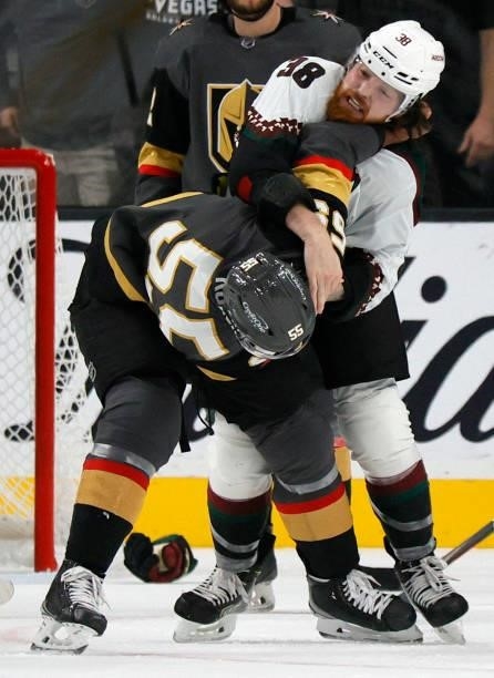 Keegan Kolesar of the Vegas Golden Knights and Liam O'Brien of the Arizona Coyotes fight in the second period of their preseason game at T-Mobile...