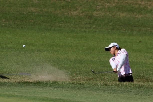 Mao Saigo of Japan hits out from a bunker on the 4th hole during the first round of the Stanley Ladies at Tomei Country Club on October 8, 2021 in...