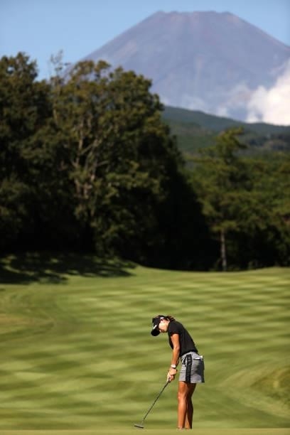 Erika Hara of Japan attempts a putt on the 5th green while Mt. Fuji is seen on the background during the first round of the Stanley Ladies at Tomei...