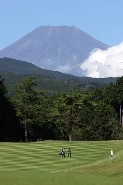 Yuna Nishimura of Japan hits her second shot on the 5th hole while Mt. Fuji is seen on the background during the first round of the Stanley Ladies at...