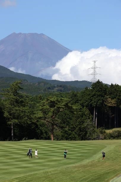 Mone Inami of Japan hits her second shot on the 5th hole while Mt. Fuji is seen on the back during the first round of the Stanley Ladies at Tomei...