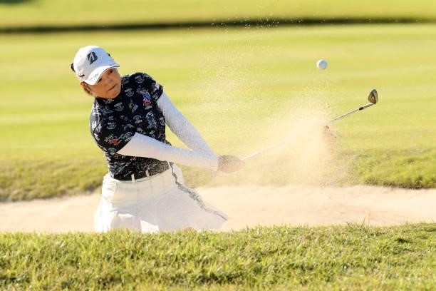 Yuna Takagi of Japan hits out from a bunker on the 8th hole during the first round of the Stanley Ladies at Tomei Country Club on October 8, 2021 in...