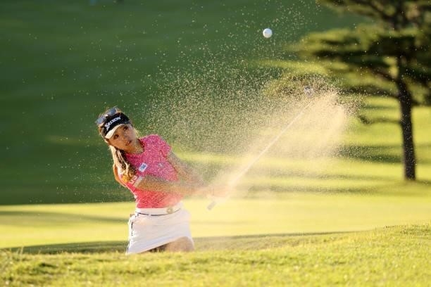 Reika Usui of Japan hits out from a bunker on the 5th hole during the first round of the Stanley Ladies at Tomei Country Club on October 8, 2021 in...
