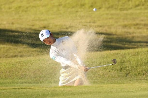 Rei Matsuda of Japan hits out from a bunker on the 8th hole during the first round of the Stanley Ladies at Tomei Country Club on October 8, 2021 in...