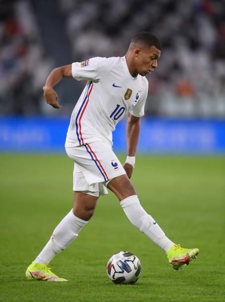 Kylian Mbappe of France runs with the ball during the UEFA Nations League 2021 Semi-final match between Belgium and France at Allianz Stadium on...