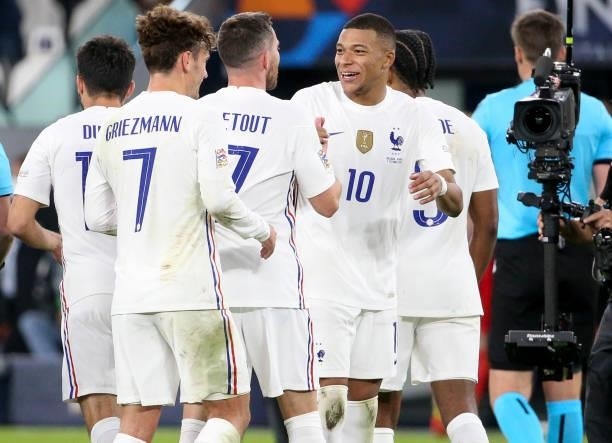 Kylian Mbappe of France and teammates celebrate the victory following the UEFA Nations League 2021 Semi-final match between Belgium and France at...