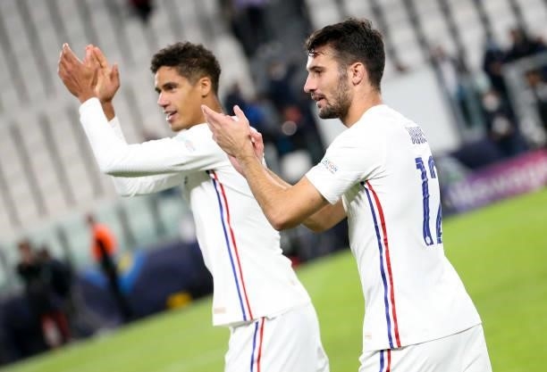 Raphael Varane, Leo Dubois of France celebrate the victory following the UEFA Nations League 2021 Semi-final match between Belgium and France at...