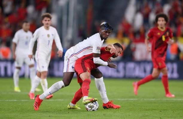Eden Hazard of Belgium is tackled by Paul Pogba of France during the UEFA Nations League 2021 Semi-final match between Belgium and France at Allianz...