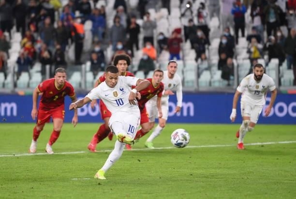 Kylian Mbappe of France scores from the penalty spot during the UEFA Nations League 2021 Semi-final match between Belgium and France at Allianz...