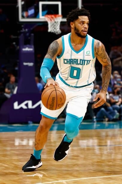 Miles Bridges of the Charlotte Hornets dribbles during the first period of their game against the Memphis Grizzlies at Spectrum Center on October 07,...
