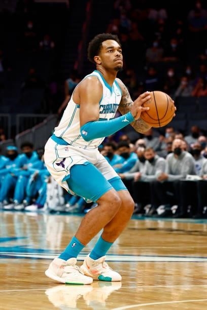 Washington of the Charlotte Hornets attempts a three point basket during the first period of their game against the Memphis Grizzlies at Spectrum...