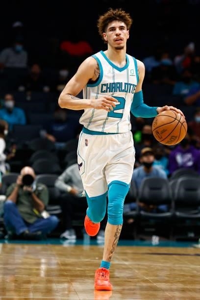 LaMelo Ball of the Charlotte Hornets brings the ball up court during the first period of their game against the Memphis Grizzlies at Spectrum Center...