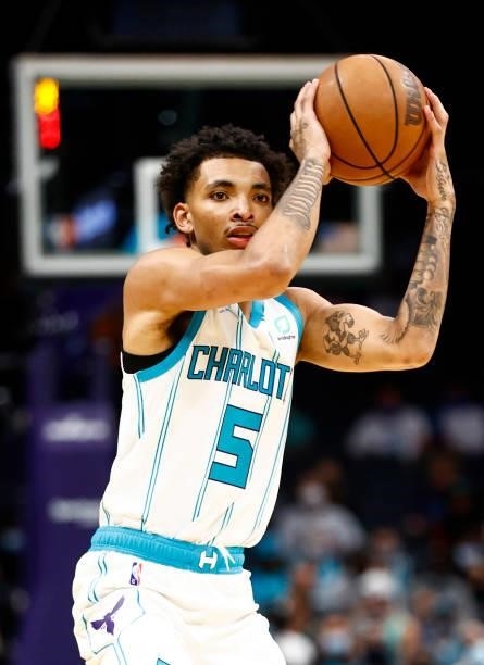 James Bouknight of the Charlotte Hornets looks to pass during the first period of their game against the Memphis Grizzlies at Spectrum Center on...