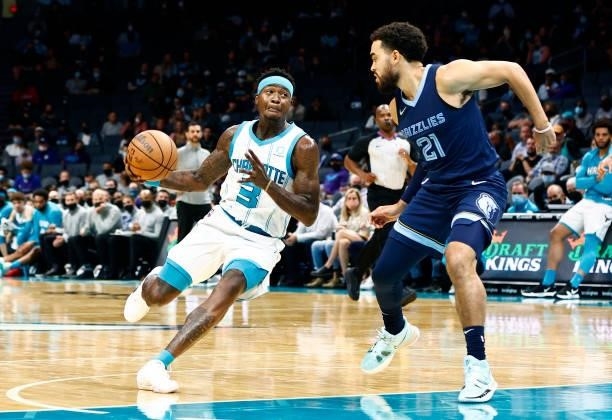 Terry Rozier of the Charlotte Hornets drives to the basket against Tyus Jones of the Memphis Grizzlies during the first period of their game at...
