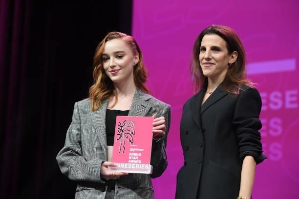 Phoebe Dynevor, next to the editor in chief of French magazine Madame Figaro Clara Dufour, receives the Canneseries Rising Star Award during the...