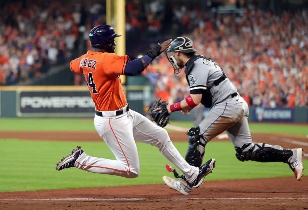 Yordan Alvarez of the Houston Astros scores on a double hit by Carlos Correa during the 7th inning of Game 2 of the American League Division Series...