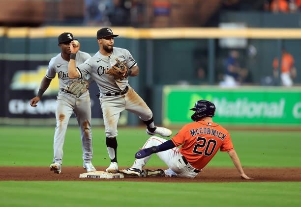 Leury Garcia of the Chicago White Sox gets a force out on Chas McCormick of the Houston Astros during the 6th inning of Game 2 of the American League...