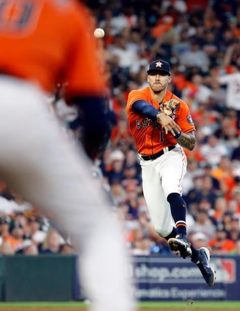 Carlos Correa of the Houston Astros throws toward first during the 9th inning of Game 2 of the American League Division Series against the Chicago...